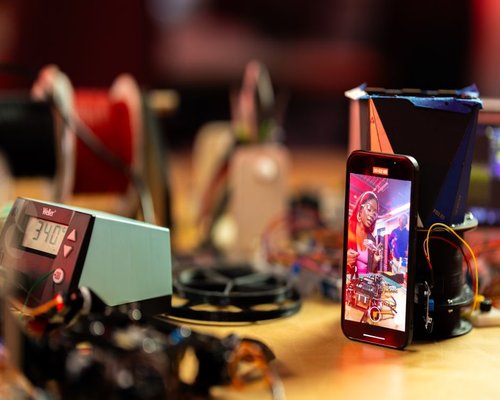 Smartphone displaying the fictional Crown Circuit Crafter game on ArcadeCrownWorks Australia