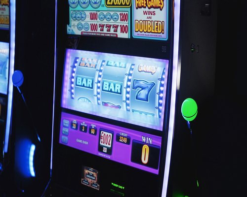 Futuristic arcade machine showing the fictional Neon Workshop Rally game