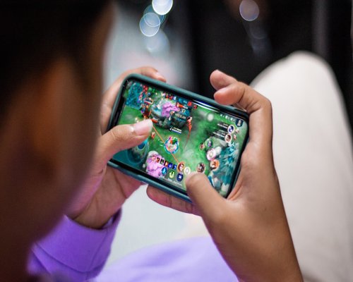 Smartphone displaying the fictional Koala Gear Quest game for BEGINNERS